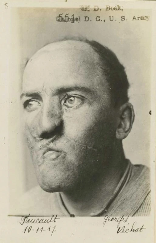 a very old po of a baseball player looking at the camera