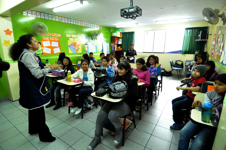 an elementary classroom filled with children sitting at desks