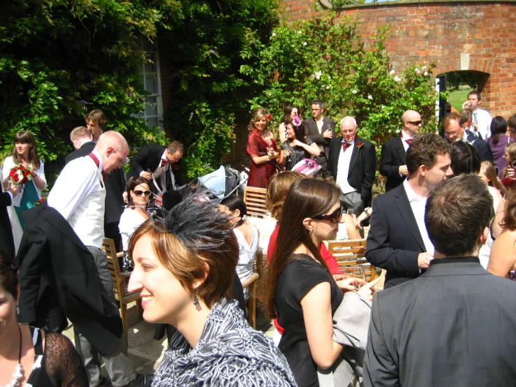 a party full of people on a bricked area