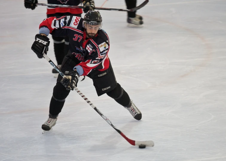 the young male player moves along the ice