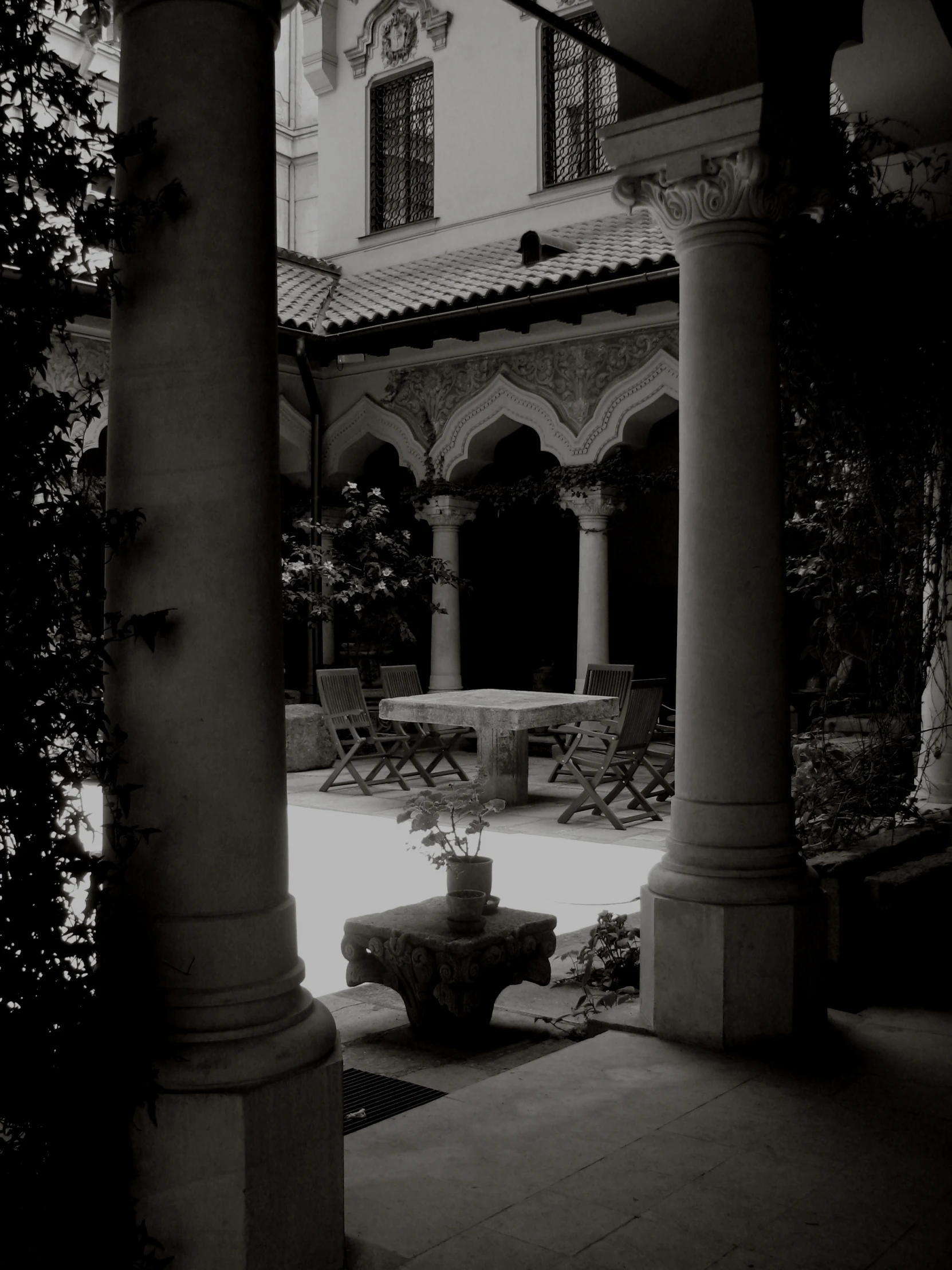 black and white pograph of an outside patio with chairs