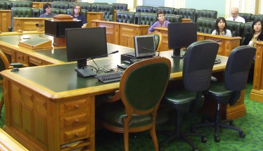 people sitting at desks working with computers