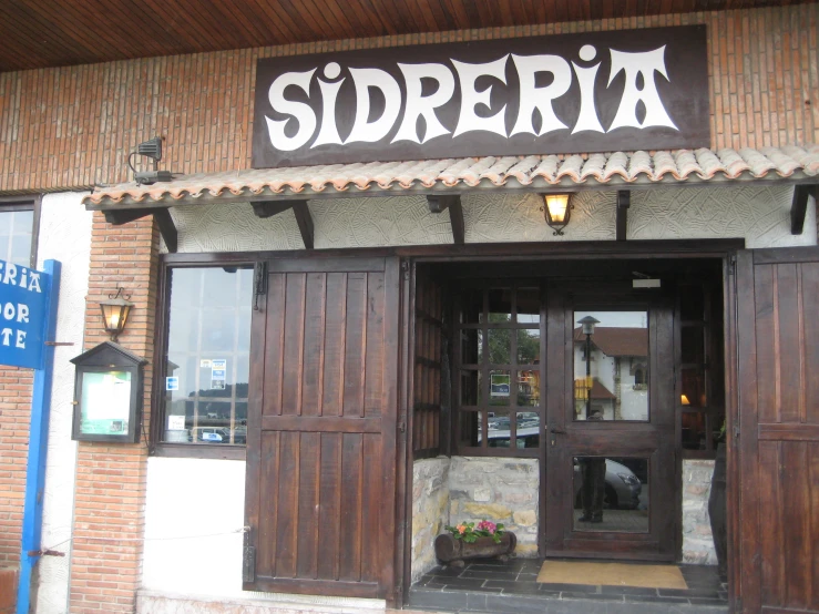 a restaurant called sidderita is closed with wooden doors and large windows