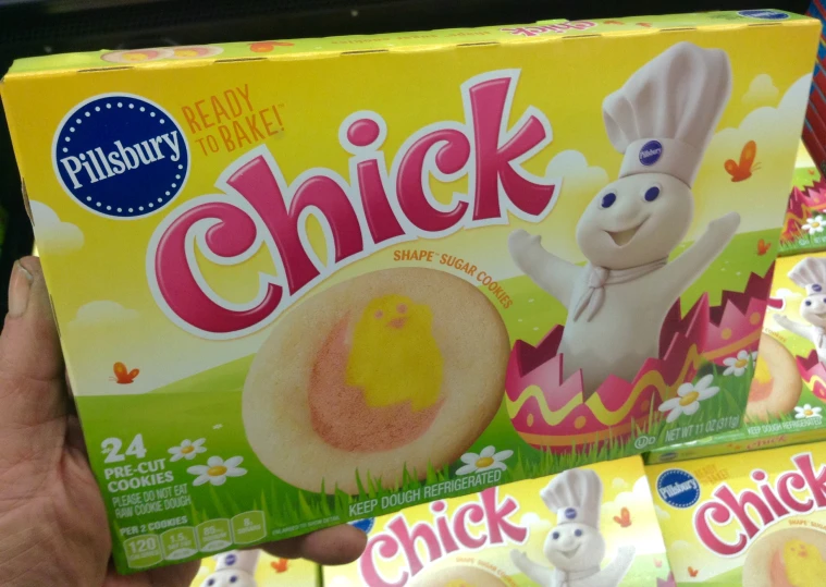 a person holding up a box of ers with bunny in an egg