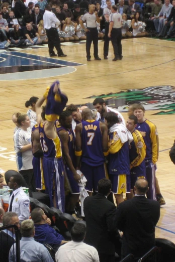 a team of basketball players congratulate each other