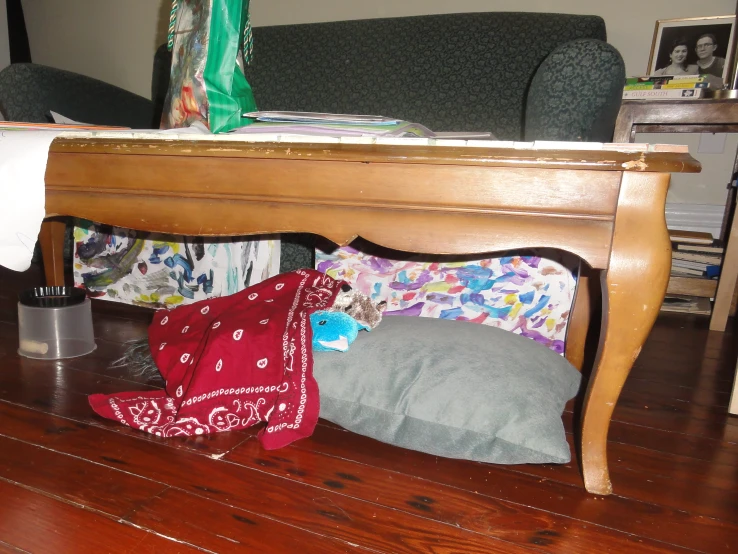 a large table with pillows and blankets underneath it