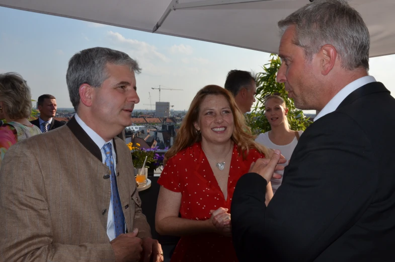 a man in a suit and tie talking to someone