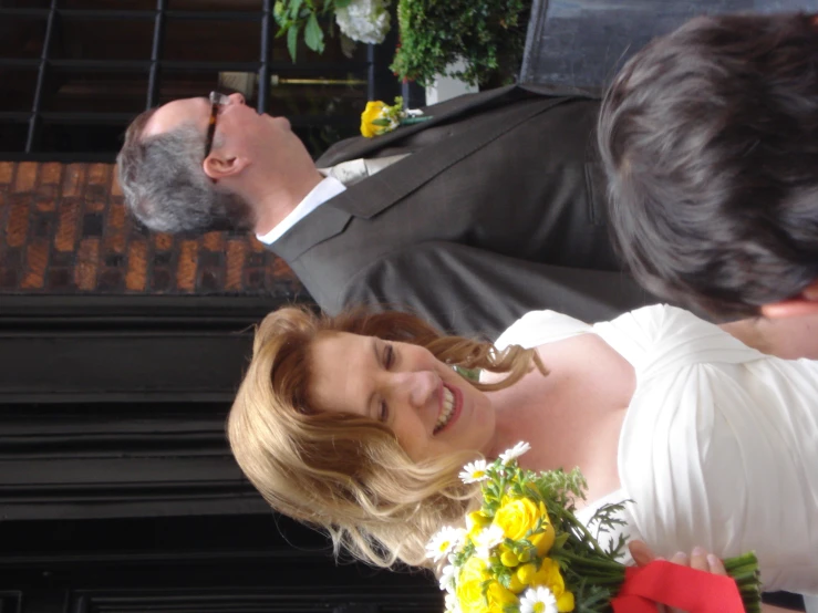 the bride is laughing as she walks down the aisle