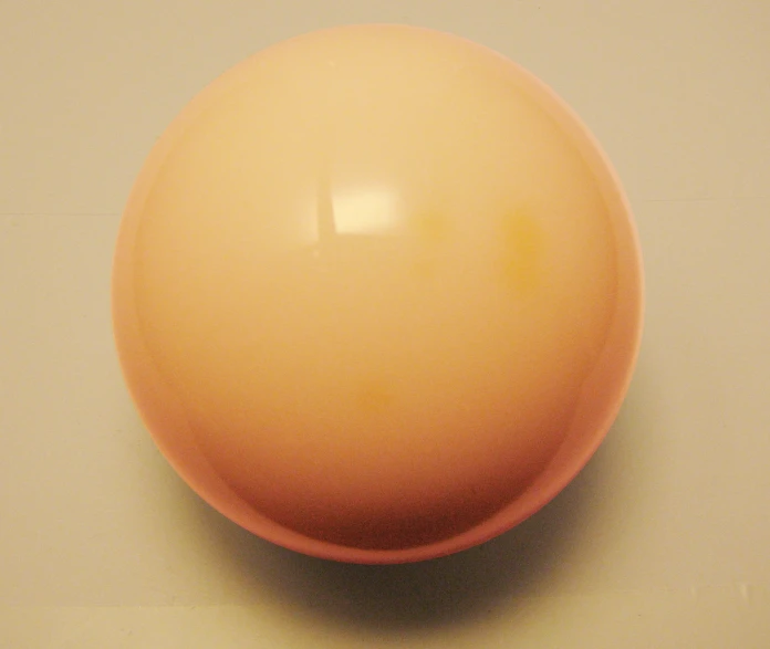 a round yellow object is sitting on a table