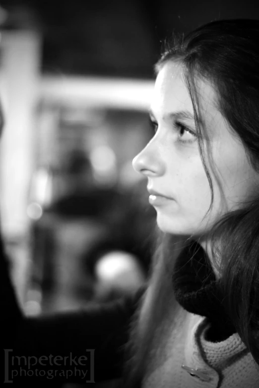 black and white pograph of young woman with long hair