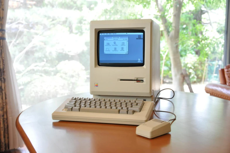 a computer that is sitting on a desk in the middle of a room