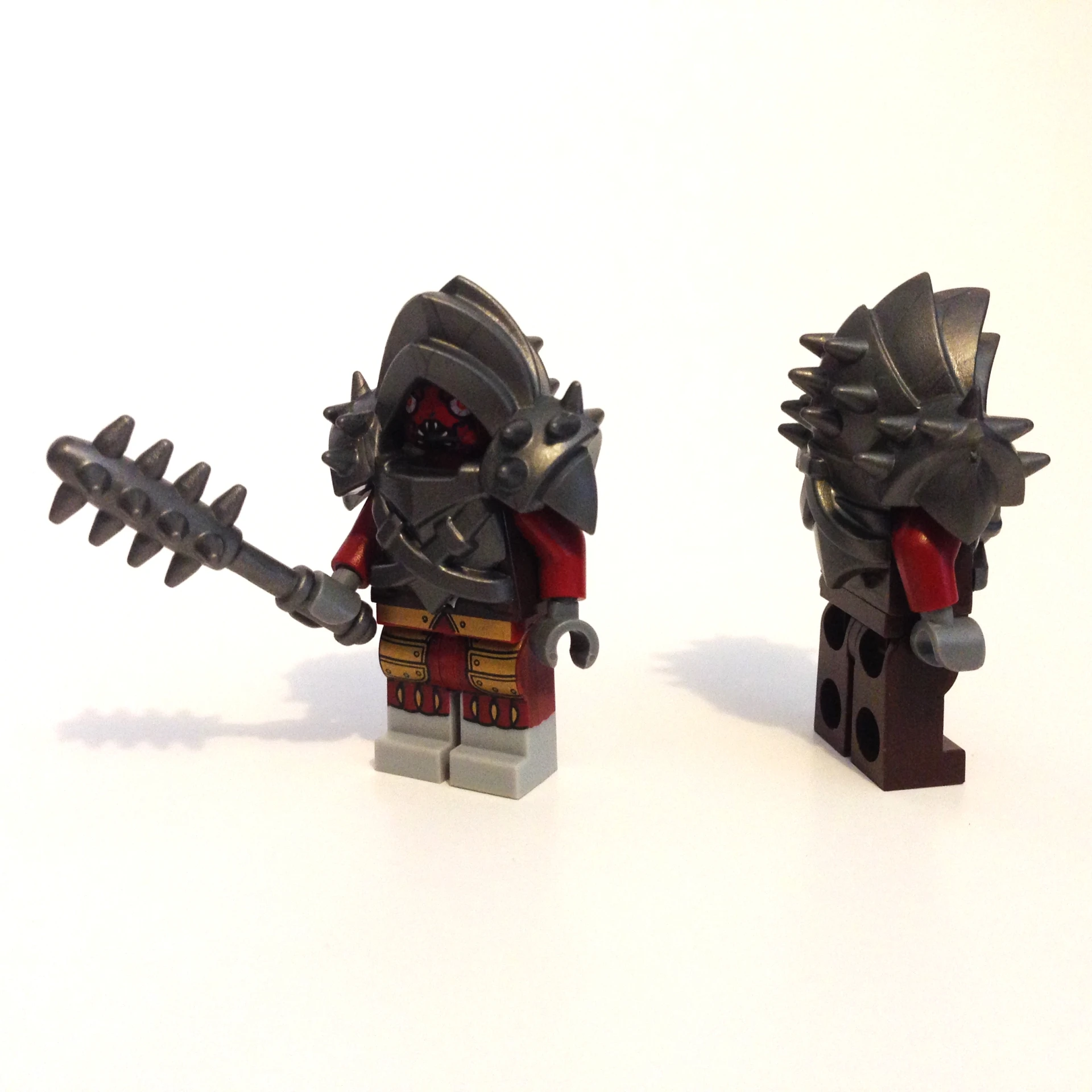 some lego figurines, one with spikes and two with claws