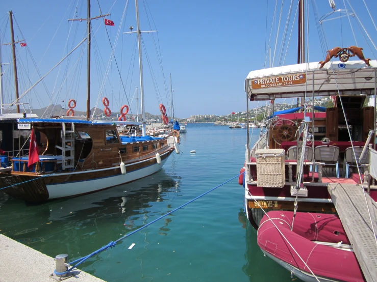 two boats docked near each other in the water