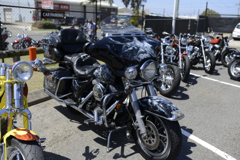 a row of parked motorcycles sitting in the street