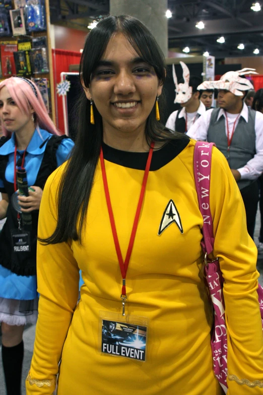 a woman with a star trek pin outfit
