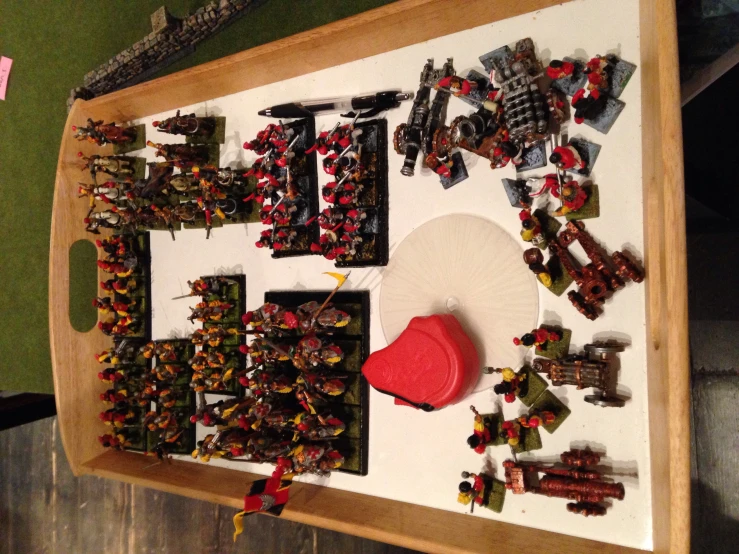 a large tray full of lego soldiers and warhammers