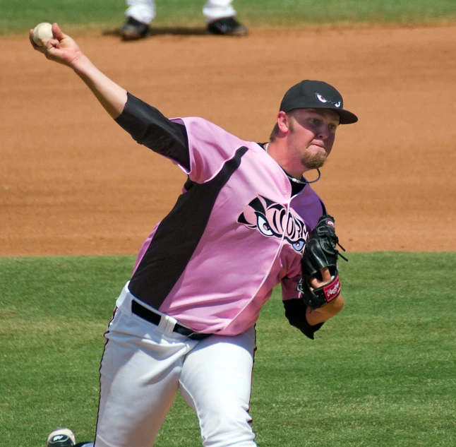 a man in a baseball uniform is throwing a ball