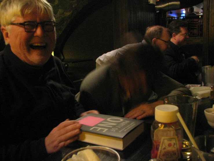 a man eating lunch and drinking a drink