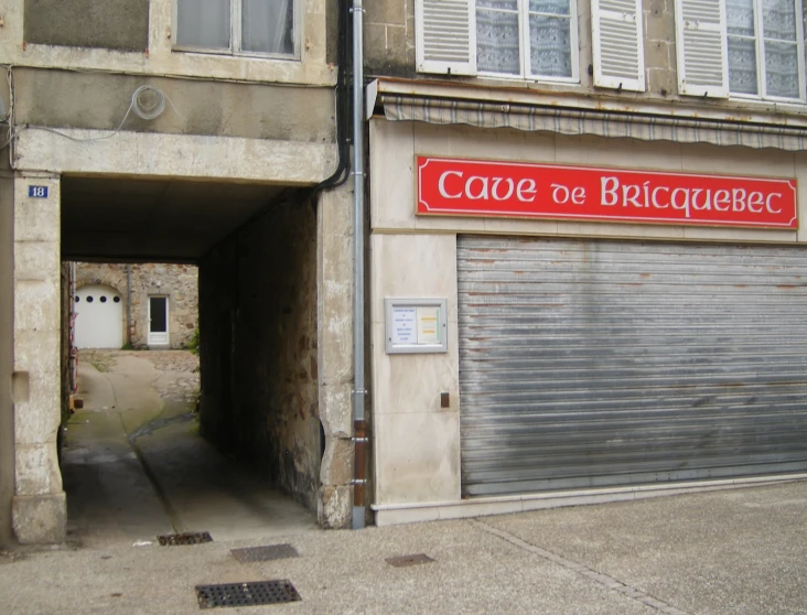 a closed garage with the sign cape de bacque on it