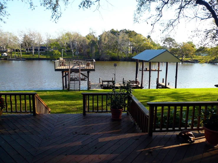 a view of a lake and a dock from a deck