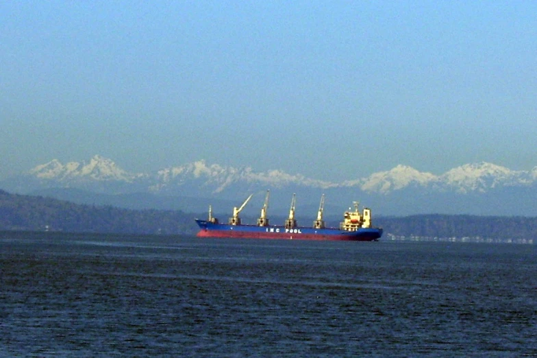 the big cargo ship is floating in the open water