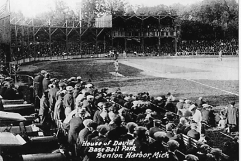 an old pograph of a baseball game with many players