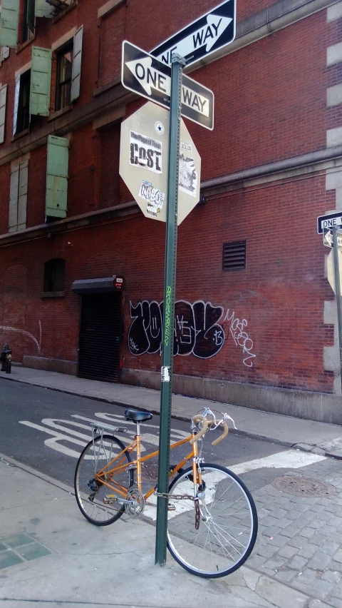 a stop sign is posted next to a bike