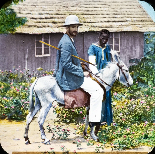 a couple is standing beside a horse by a building