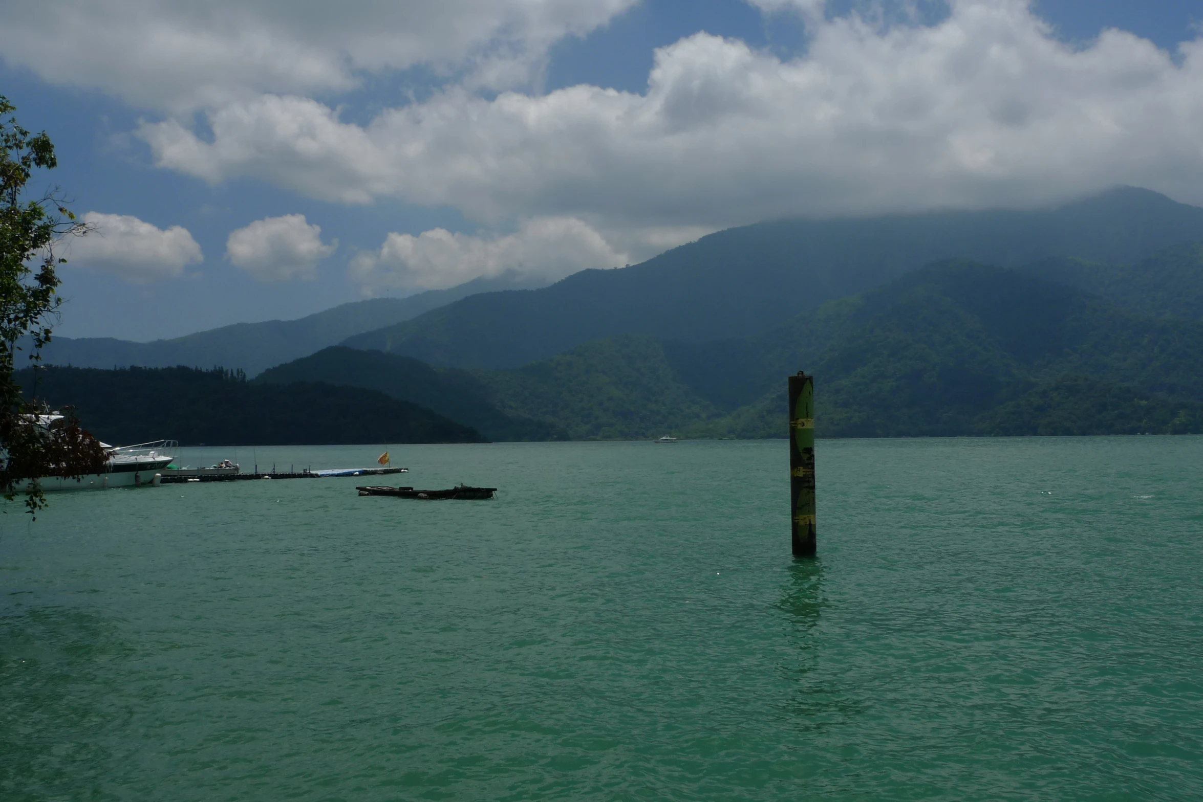 a body of water with two boats floating on it