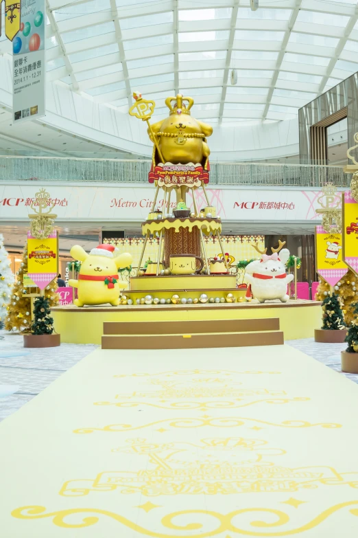 a fancy stage with a large yellow decorative crown