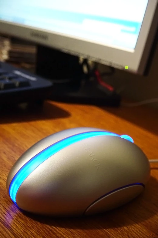 a sleek computer mouse resting on a desk