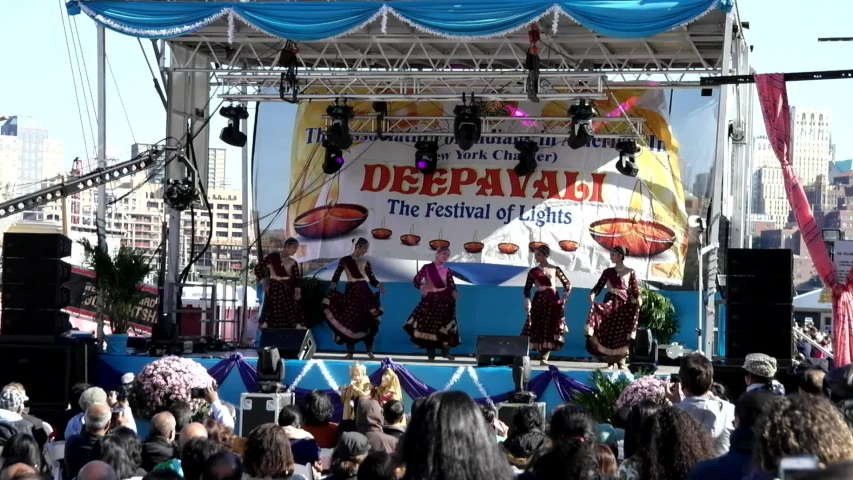 performers at a festival on stage for an audience