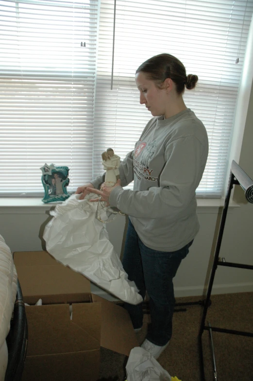 a person placing a bag on a table in a room