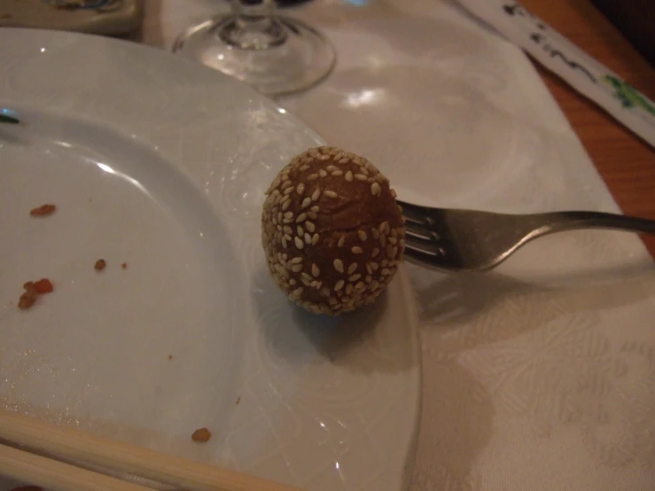 a fork that is next to a bowl on a table