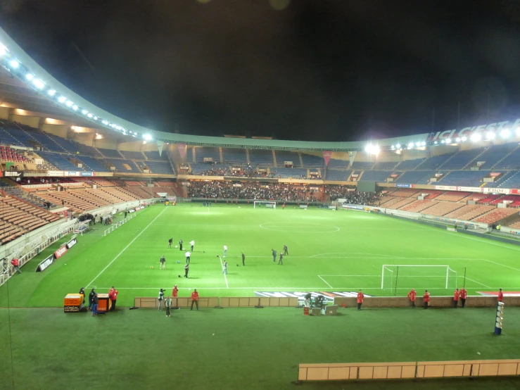 the large soccer field has lots of empty seats