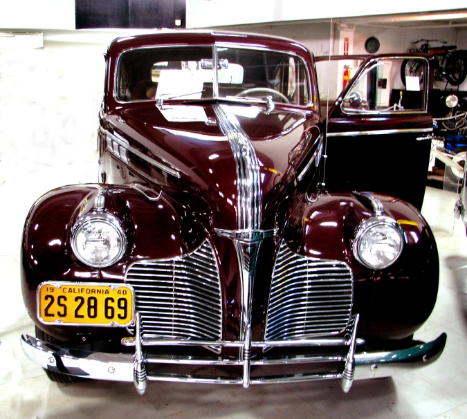 a classic car in a garage on display