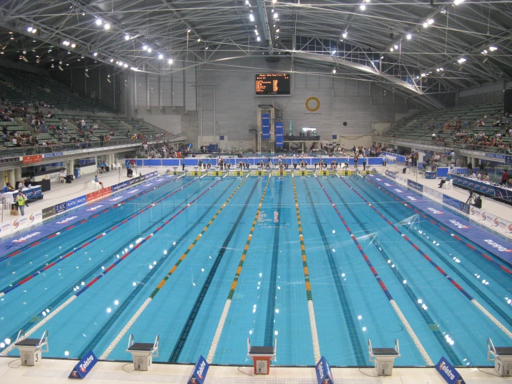 a large swimming pool with many people