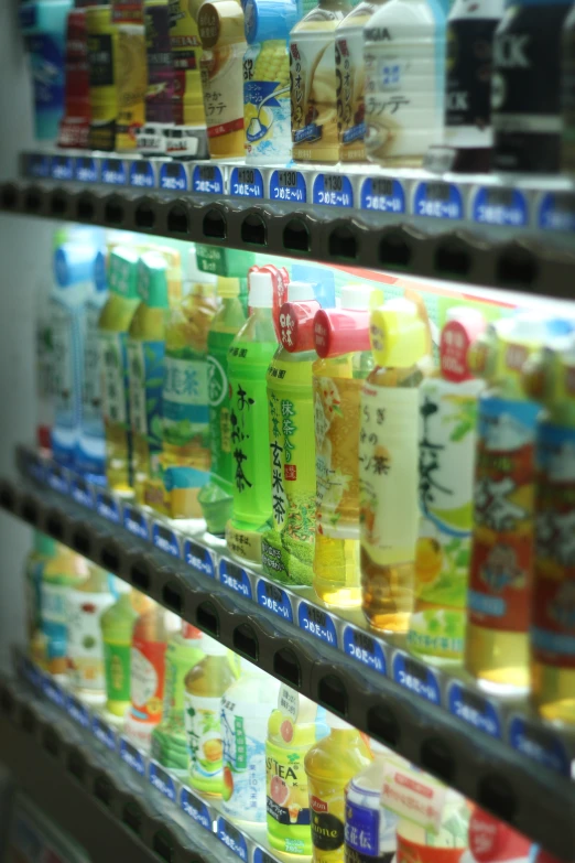 an asian shelf of drinks and sodas in a grocery store
