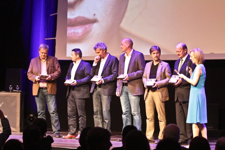 a group of people standing on a stage