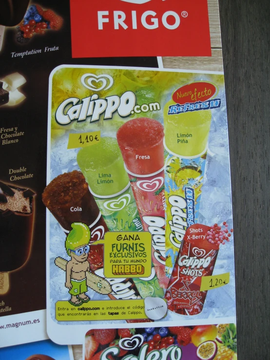 three assorted candy stickers are on top of a print ad