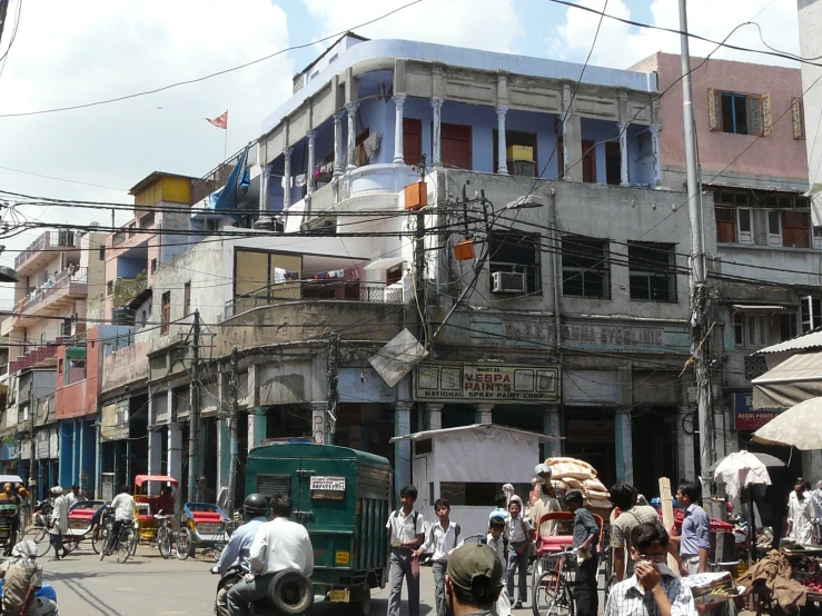 a city street with lots of people and buildings