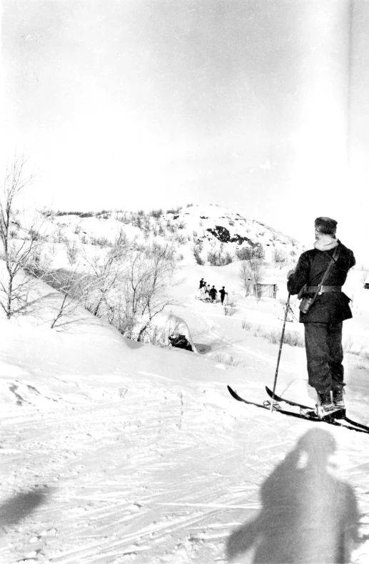 a person riding skis on a snowy surface