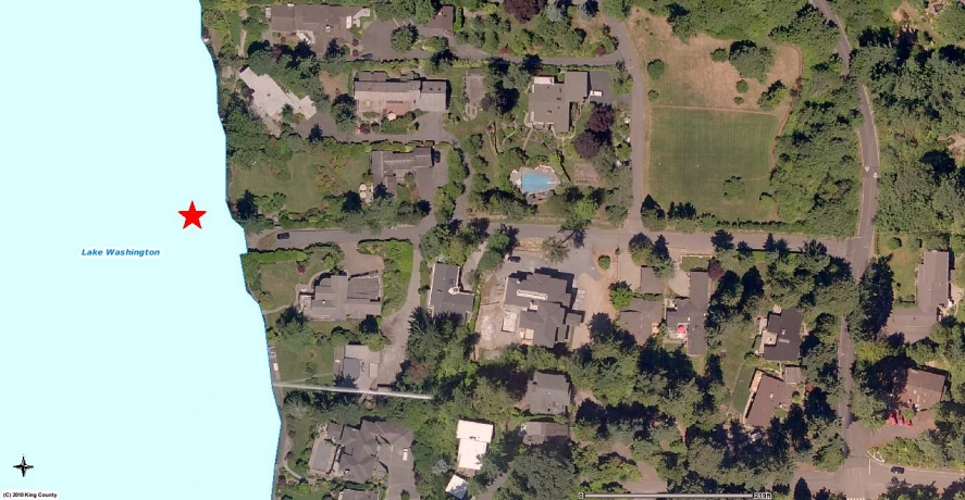 a bird's eye view shows the house at right