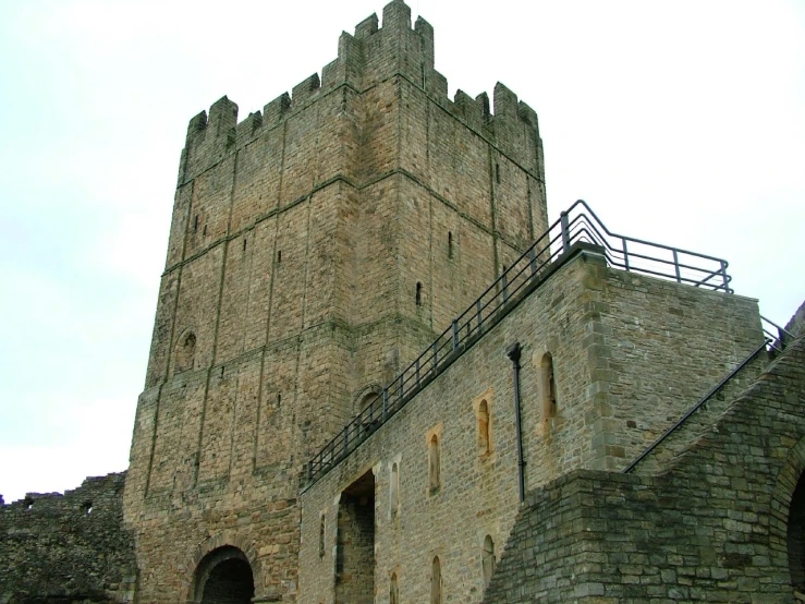 a very tall castle with a small ladder up to it