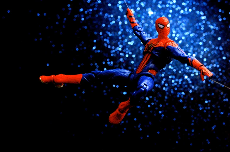 a toy figurine of the amazing spider man