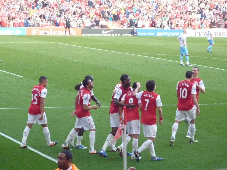 the men are on the field talking to each other