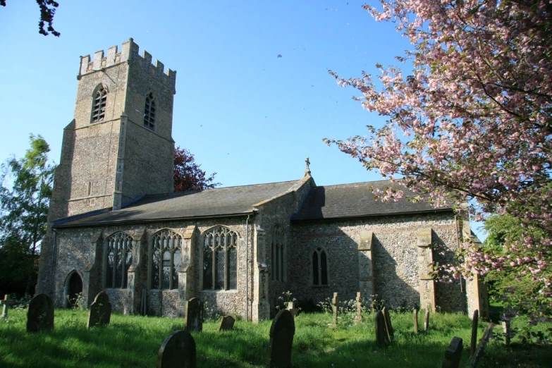 a very old church in a big grassy area