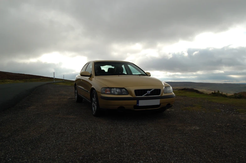 this is a car parked on the side of a road