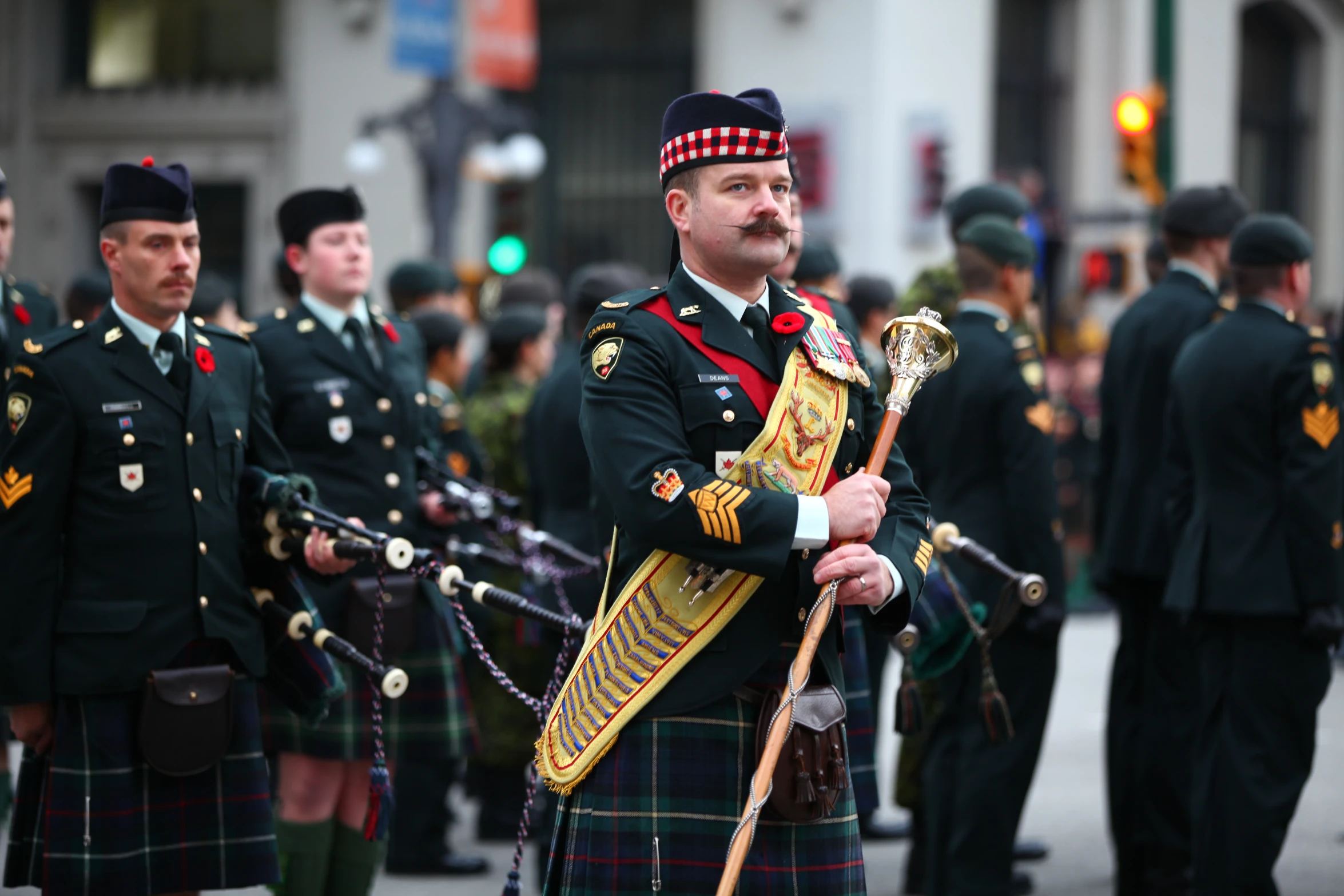 the men are marching in a military parade