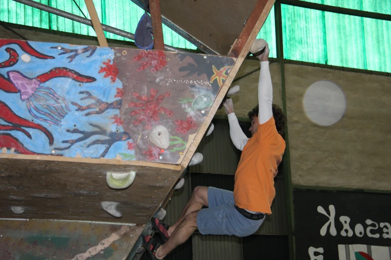 a man hanging upside down on a surfboard